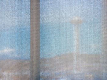 Contemporary mesh fabric roller shades on all windows