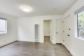 San Francisco apartment for rent - A room with a white ceiling, a window, a door, and a wooden floor.