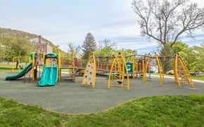 West Point apartment for rent - a playground with slides and other toys in a park