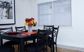 West Point apartment for rent - a dining room with a table and chairs and a vase of flowers