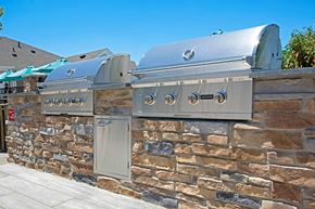 Sewell apartment for rent - a stone wall with two bbq grills on it