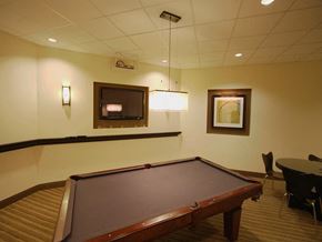 Washington apartment for rent - a game room with a pool table and a tv