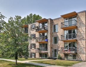 Calgary apartment for rent - an image of a brick apartment building with balconies