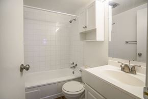 Calgary apartment for rent - a bathroom with a sink toilet and a bath tub