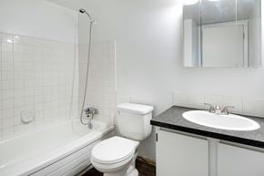 High River apartment for rent - a white bathroom with a sink toilet and tub