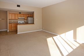 Calgary apartment for rent - an empty living room with a kitchen in it