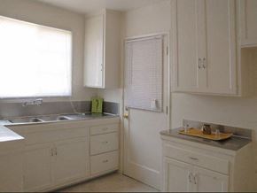 Los Angeles apartment for rent - A kitchen with white cabinets and a sink.