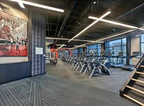Union apartment for rent - A gym with a row of treadmills and a poster on the wall.