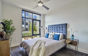 Union apartment for rent - A bedroom with a large bed and a ceiling fan.