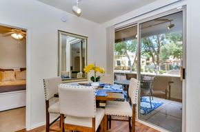 Phoenix apartment for rent - a dining room with a table and chairs and sliding glass doors to a patio