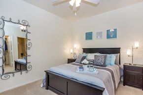 Phoenix apartment for rent - a bedroom with a bed and a ceiling fan