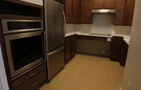 Northampton apartment for rent - a kitchen with stainless steel appliances and wooden floors