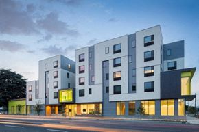 Portland apartment for rent - a rendering of a building on a city street