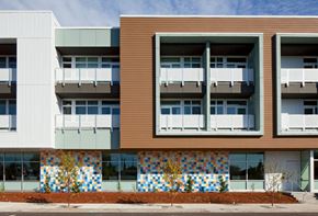 Portland apartment for rent - a row of apartment buildings with colorful facade and balconies