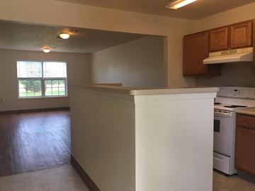 Farmington townhouse for rent - A kitchen with a white counter top and a window.