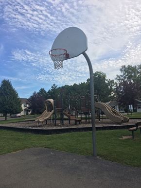 Farmington townhouse for rent - A basketball hoop is mounted on a pole at a playground.