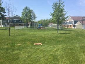 Jamestown apartment for rent - a park with a playground and houses in the background