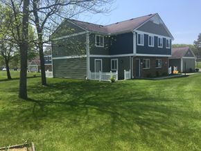 Jamestown apartment for rent - a house with a lawn and a tree in front of it