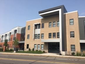 Rochester apartment for rent - a new apartment building on the side of a street