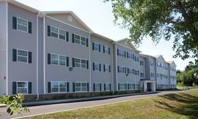 Rochester apartment for rent - a large apartment building with a street in front of it
