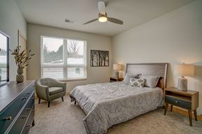 Madison apartment for rent - a bedroom with a bed and a ceiling fan