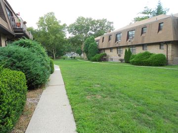 River Vale apartment for rent - a large lawn in front of an apartment building