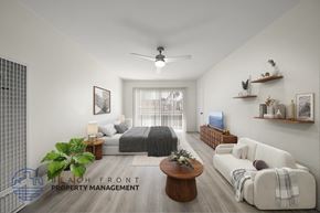 Los Angeles apartment for rent - A living room with a couch, a bed, and a coffee table.