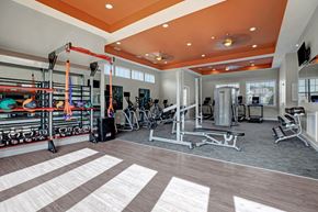 Charlotte apartment for rent - Gym. Free weights, medicine balls, work out bench, ellipticals, bikes, treadmills, and a TV at Ascent at Mallard Creek Charlotte, NC