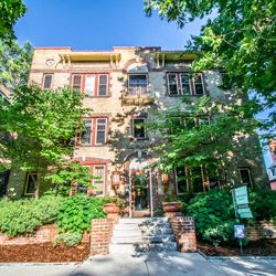 Denver apartment for rent - a large brick house with trees in front of it