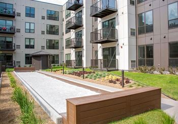 Bocce ball court at confluence on 3rd apartments in des moines in downtown des moines