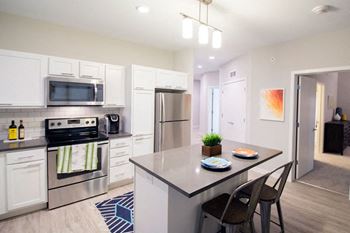 Kitchen at confluence on 3rd apartments in des moines in downtown des moines