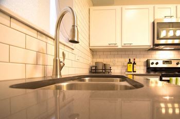 Kitchen sink in confluence on 3rd apartments in des moines in downtown des moines