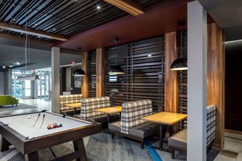 Pool and club room at confluence on 3rd apartments in des moines in downtown des moines