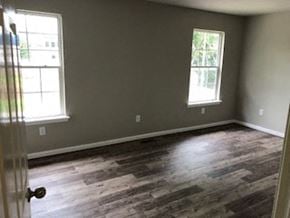 Lexington apartment for rent - an empty room with wood floors and two windows