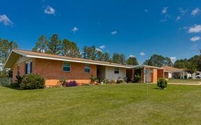Meridian apartment for rent - a brick house with a yard in front of it