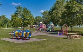 Meridian apartment for rent - a playground with a bunch of playground equipment in a park