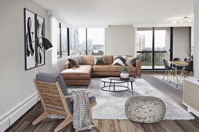 Burnaby apartment for rent - a living room with a couch and a chair and a table