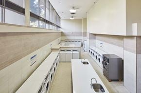 Toronto apartment for rent - a large kitchen with white counter tops and a large window