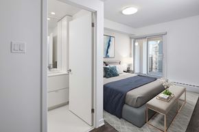 Toronto apartment for rent - a bedroom with a large bed and a window