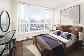 Vancouver apartment for rent - a bedroom with a large window and a bed and a view of the city