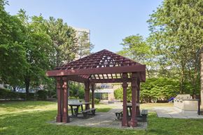 Toronto apartment for rent - a picnic area with a wooden gazebo and benches