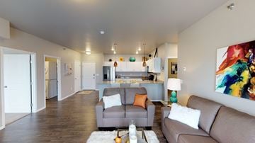 Fargo apartment for rent - a living room with a couch and a chair and a kitchen