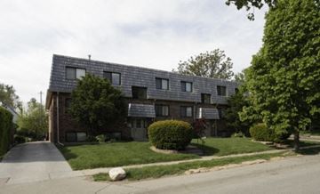 Omaha apartment for rent - an apartment building with solar panels on the roof