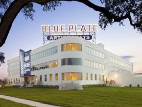 New Orleans apartment for rent - a large white building with a sign on top of it