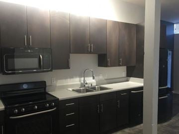 Jackson apartment for rent - a kitchen with a sink and a stove and a microwave