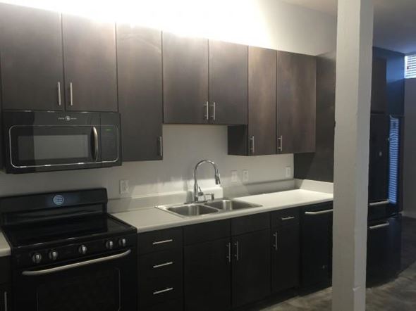 Jackson apartment for rent - a kitchen with a sink and a stove and a microwave