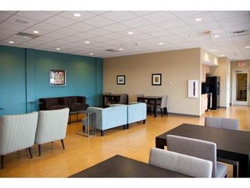 Jackson apartment for rent - a living room with couches and tables and chairs