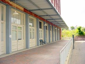 Shreveport apartment for rent - A long row of windows with a bench in front of them.