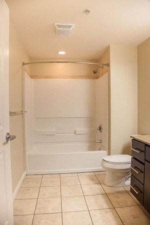 Maple toned flooring and ceramic tile