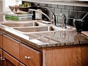 Jackson apartment for rent - a kitchen sink with two faucets on a counter top